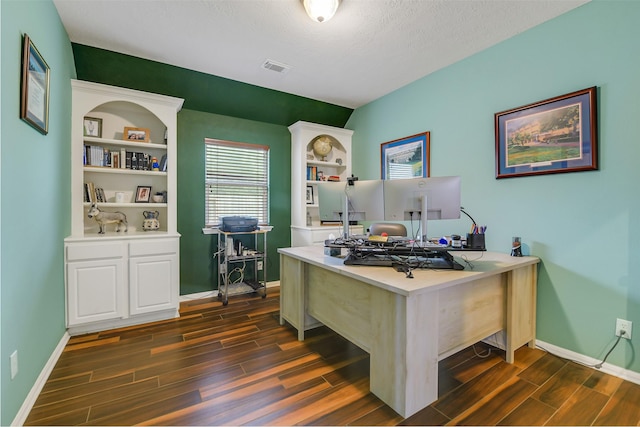 home office with baseboards, visible vents, and dark wood-style floors