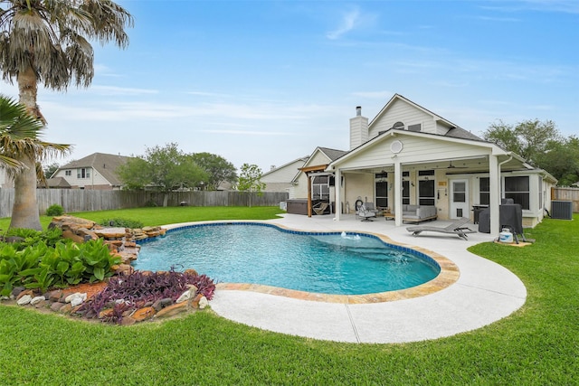 view of swimming pool with a fenced backyard, a patio area, central air condition unit, and a yard