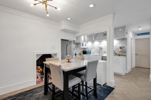 dining room featuring recessed lighting and a notable chandelier