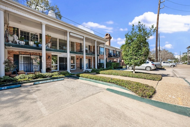 view of property with uncovered parking