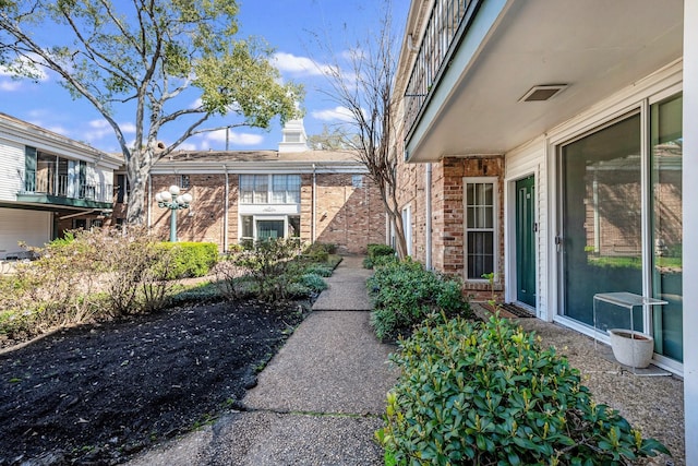 view of home's exterior featuring brick siding