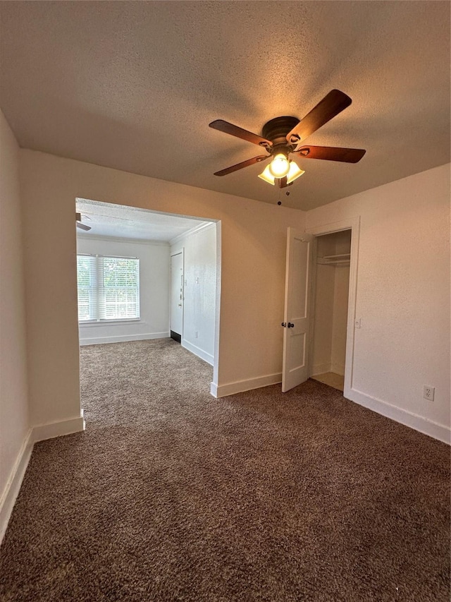 2711 Ruth St, Houston, TX 77004 - spare room featuring ceiling fan, baseboards, a textured ceiling, and carpet