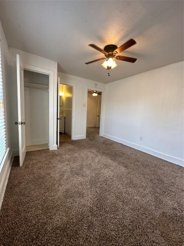 2711 Ruth St, Houston, TX 77004 - unfurnished bedroom featuring a ceiling fan, a textured ceiling, a closet, carpet floors, and baseboards