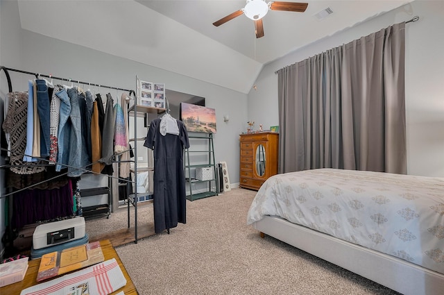 bedroom with ceiling fan, visible vents, vaulted ceiling, baseboards, and carpet