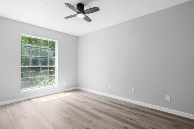 13400 Nicholson Rd, Conroe, TX 77303 - unfurnished room featuring wood finished floors and a ceiling fan