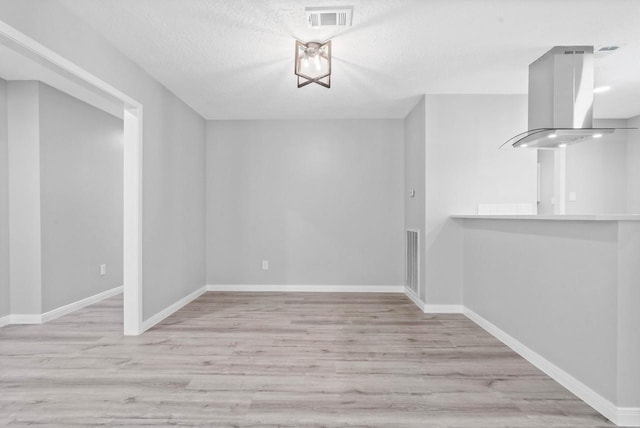 13400 Nicholson Rd, Conroe, TX 77303 - unfurnished dining area featuring wood finished floors and a textured ceiling