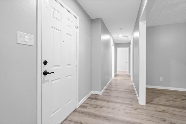 13400 Nicholson Rd, Conroe, TX 77303 - corridor with attic access and light wood-style floors