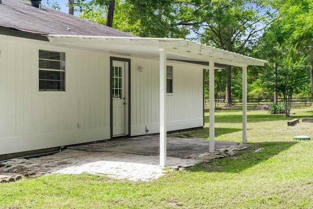 13400 Nicholson Rd, Conroe, TX 77303 - back of property with a lawn, a patio, and a shingled roof