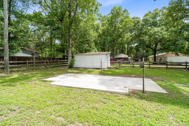 13400 Nicholson Rd, Conroe, TX 77303 - fenced backyard featuring a patio area, a storage shed, and view of scattered trees