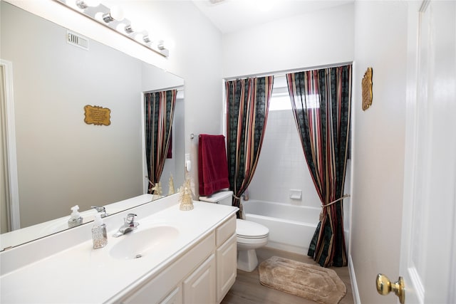 bathroom with shower / tub combo with curtain, vanity, toilet, wood finished floors, and visible vents