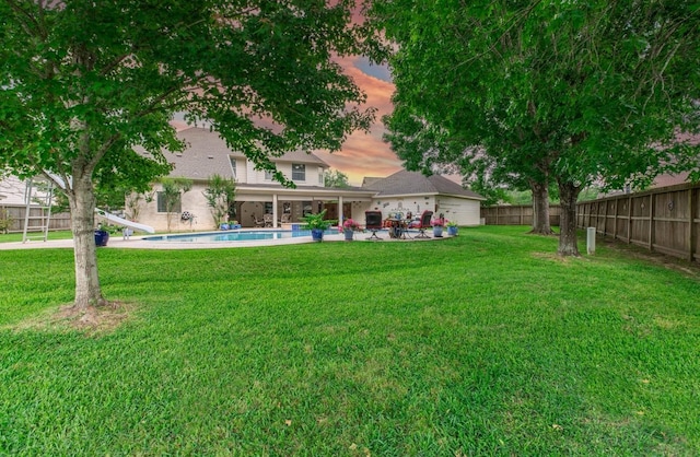 view of yard with a patio, a fenced in pool, and a fenced backyard