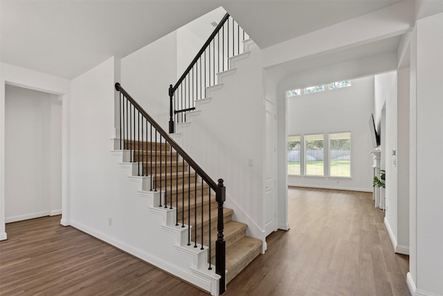40805 Iver Ln, Magnolia, TX 77354 - staircase featuring wood finished floors and baseboards