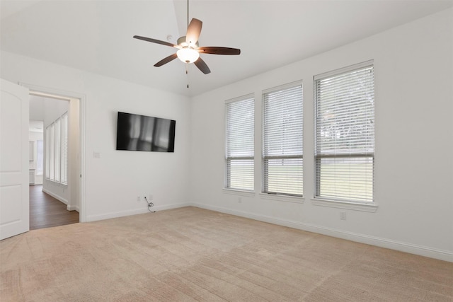 40805 Iver Ln, Magnolia, TX 77354 - spare room featuring a ceiling fan, light carpet, and baseboards