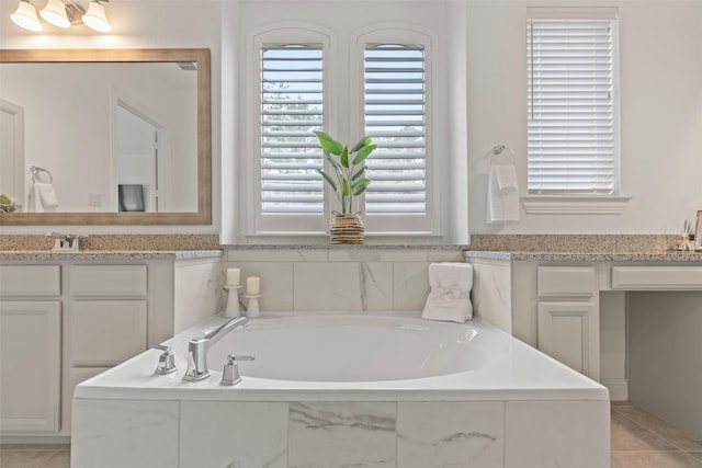 40805 Iver Ln, Magnolia, TX 77354 - full bathroom with tile patterned floors, a healthy amount of sunlight, vanity, and a garden tub