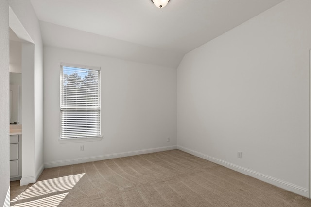 40805 Iver Ln, Magnolia, TX 77354 - empty room featuring baseboards, light colored carpet, and lofted ceiling