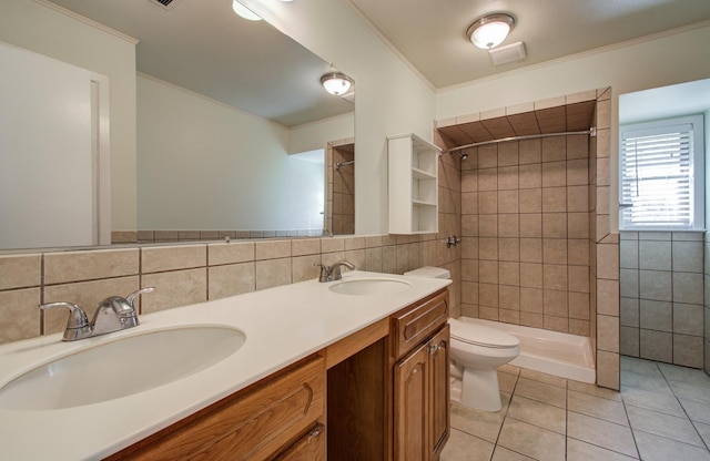 11307 Birdwing Ln, Houston, TX 77067 - full bathroom featuring tile walls, tile patterned floors, toilet, and a sink
