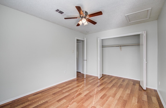 11307 Birdwing Ln, Houston, TX 77067 - unfurnished bedroom featuring a textured ceiling, a closet, light wood-style floors, baseboards, and visible vents