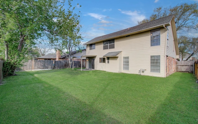 11307 Birdwing Ln, Houston, TX 77067 - rear view of house with a yard and a fenced backyard