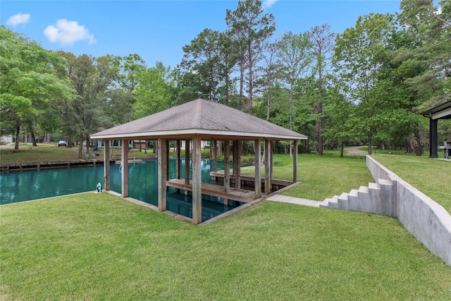 dock area featuring a gazebo and a lawn