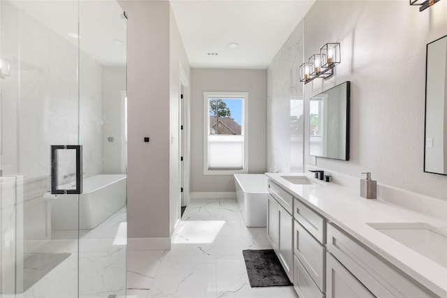 full bathroom featuring a soaking tub, marble finish floor, a sink, and double vanity