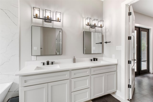 full bath with double vanity and a sink