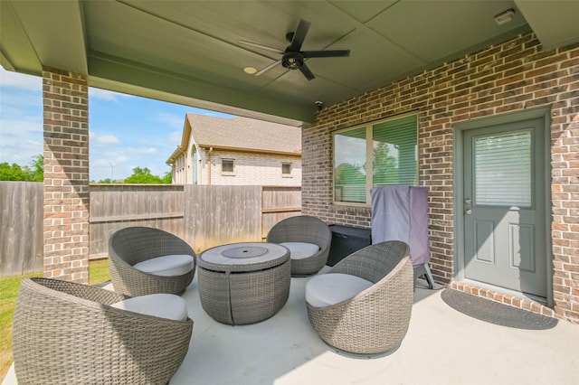 view of patio with fence and ceiling fan