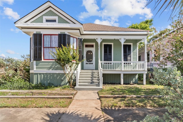 1003 Sealy St, Galveston, TX 77550 - victorian home featuring covered porch and a shingled roof