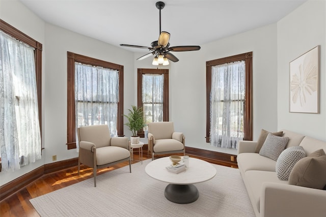 1003 Sealy St, Galveston, TX 77550 - living area featuring a ceiling fan, wood finished floors, and baseboards