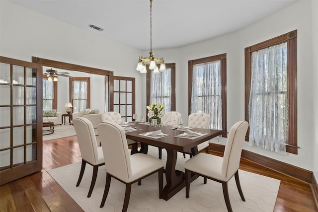 1003 Sealy St, Galveston, TX 77550 - dining room featuring a chandelier and hardwood / wood-style floors