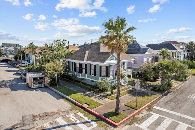 1003 Sealy St, Galveston, TX 77550 - view of front facade with a residential view and a shingled roof