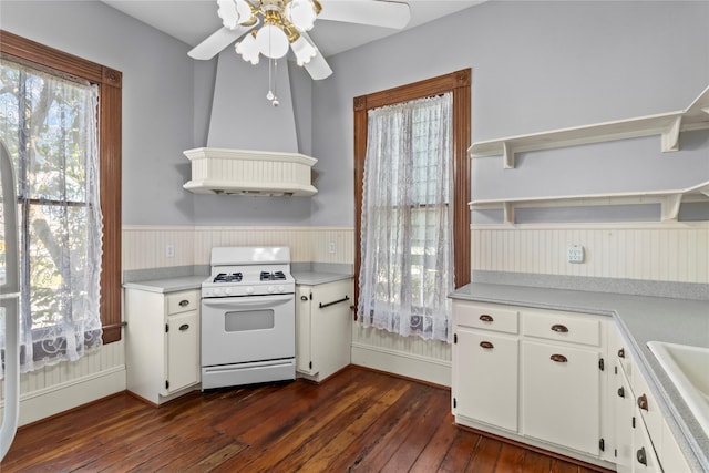 1003 Sealy St, Galveston, TX 77550 - kitchen with white range with gas stovetop, open shelves, custom exhaust hood, light countertops, and ceiling fan