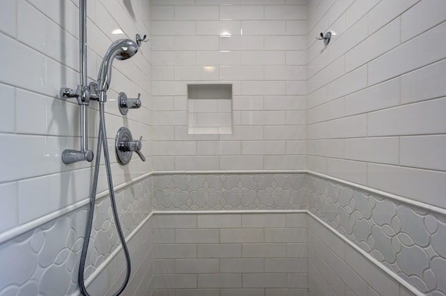 full bath featuring a tile shower