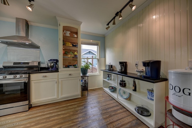 kitchen featuring track lighting, wall chimney range hood, stainless steel range with gas stovetop, and open shelves