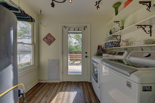 washroom with a healthy amount of sunlight, wood finished floors, laundry area, and independent washer and dryer