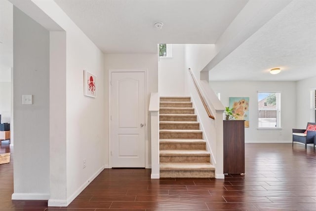8206 Caldera Ln, Cypress, TX 77433 - stairway featuring wood tiled floor and baseboards