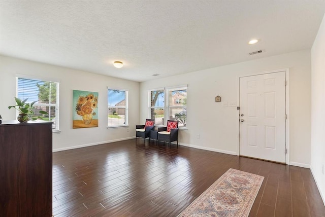 8206 Caldera Ln, Cypress, TX 77433 - entrance foyer featuring visible vents, baseboards, wood finished floors, and a healthy amount of sunlight