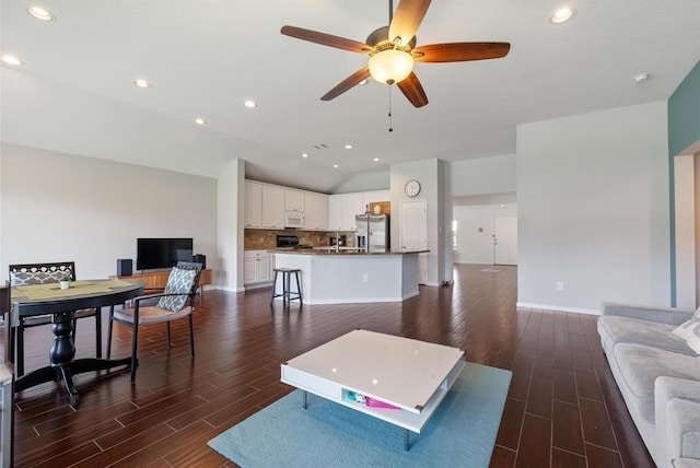 8206 Caldera Ln, Cypress, TX 77433 - living room with recessed lighting, dark wood finished floors, lofted ceiling, and ceiling fan