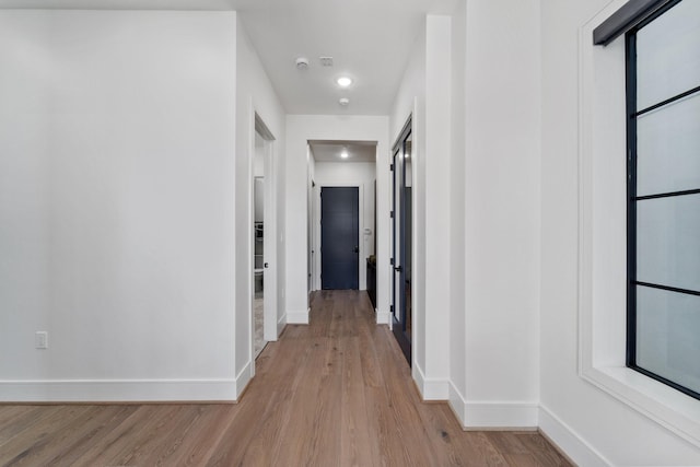948 Blackshire Ln, Houston, TX 77055 - corridor with baseboards, light wood-style flooring, and recessed lighting