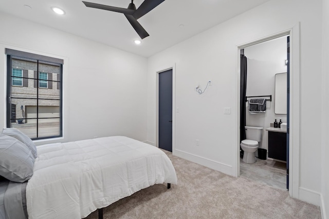 948 Blackshire Ln, Houston, TX 77055 - bedroom with light carpet, baseboards, recessed lighting, ensuite bathroom, and ceiling fan