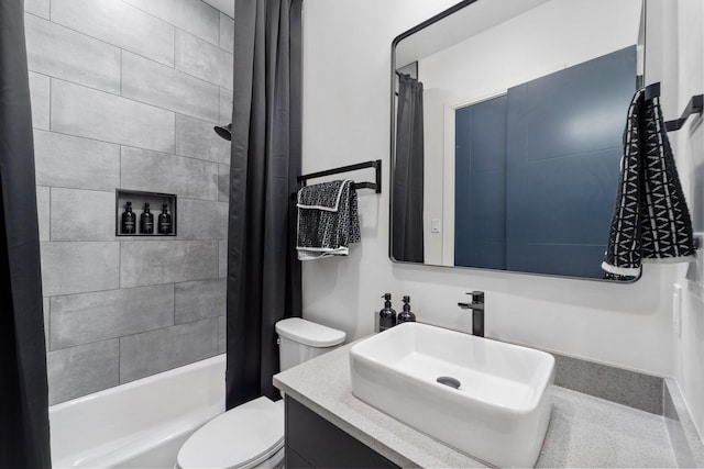 bathroom with vanity, toilet, and shower / tub combo with curtain
