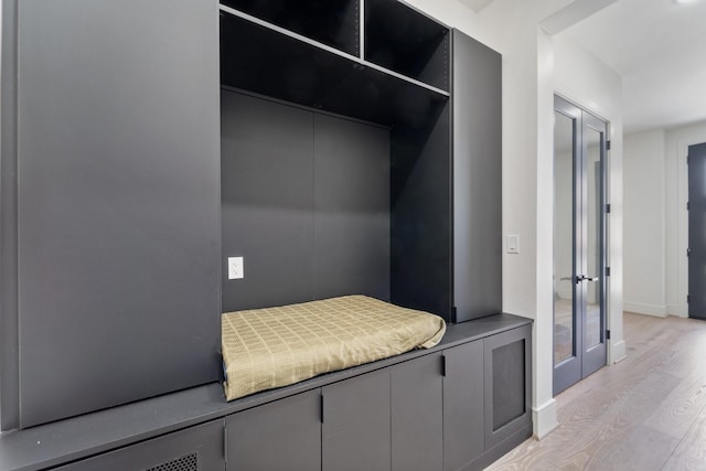 948 Blackshire Ln, Houston, TX 77055 - mudroom featuring light wood-style floors and baseboards