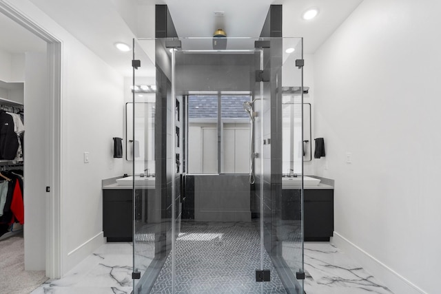 full bathroom featuring baseboards, marble finish floor, and vanity