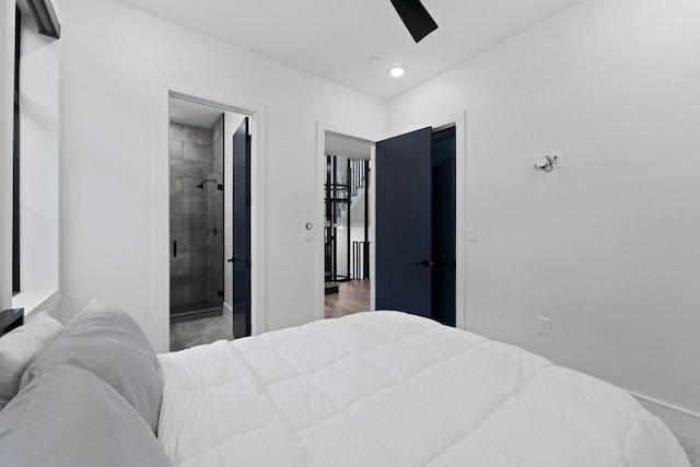 bedroom with baseboards, ceiling fan, and ensuite bath