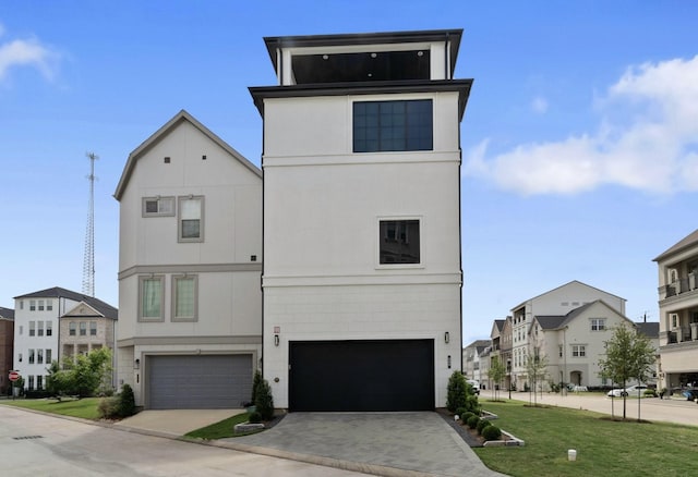 948 Blackshire Ln, Houston, TX 77055 - view of front of house with an attached garage, driveway, a residential view, and a front lawn