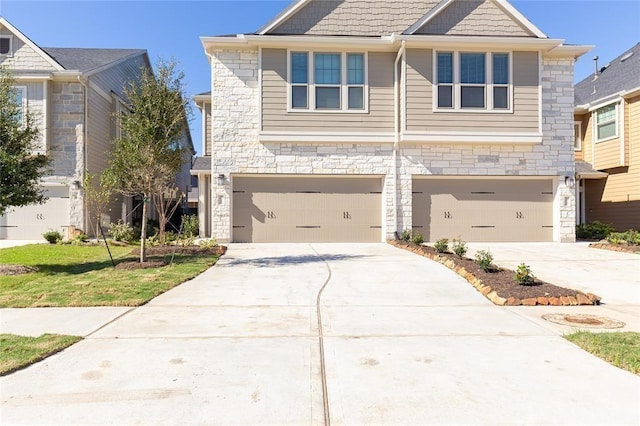 5546 Sallow Bay Ln, Fulshear, TX 77441 - view of front facade with an attached garage, stone siding, and concrete driveway