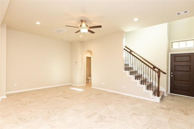 5546 Sallow Bay Ln, Fulshear, TX 77441 - foyer entrance with stairway, arched walkways, a ceiling fan, and visible vents