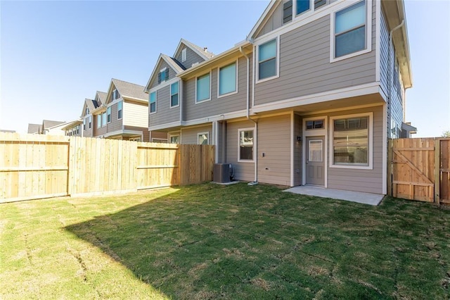 5546 Sallow Bay Ln, Fulshear, TX 77441 - back of property with cooling unit, a yard, and a fenced backyard