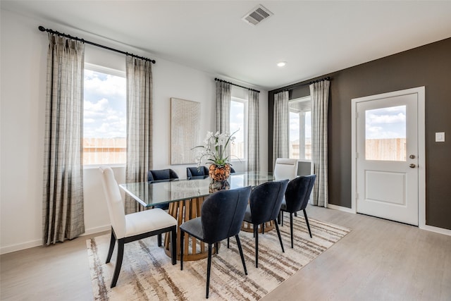 406 Robin St, Angleton, TX 77515 - dining room featuring light wood finished floors, baseboards, and recessed lighting