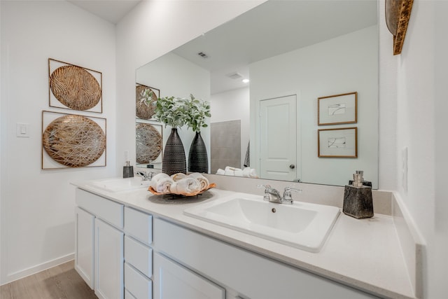 406 Robin St, Angleton, TX 77515 - bathroom with double vanity and wood finished floors