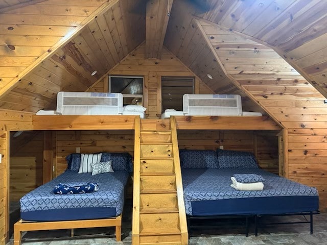 bedroom featuring wooden ceiling, vaulted ceiling, and wood walls